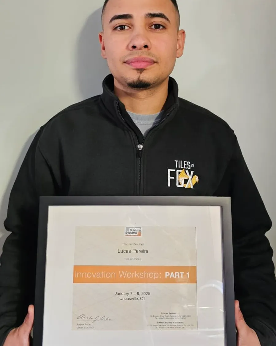 Lucas Pereira holding his Schluter-Systems Innovation Workshop certificate